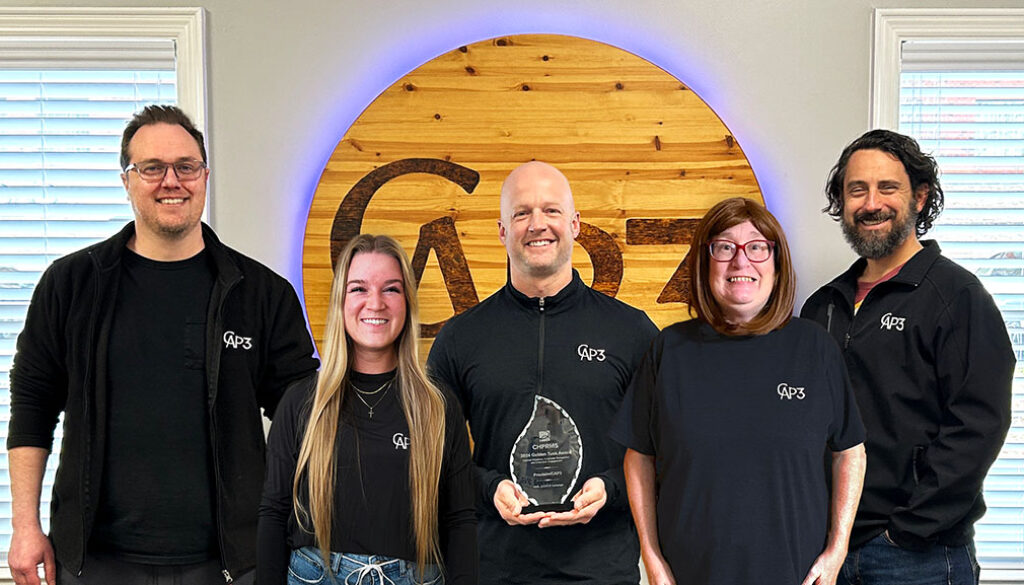 Members of the CAP3:Proclaim team celebrate their recent Golden Tusk Award. From left, Web Director Mitch Thompson, Digital Marketing Specialist Meredith Fricke, CEO Adam Tartt, Writer Dawn Wilson and Chief Marketing Officer Matthew Coleman.